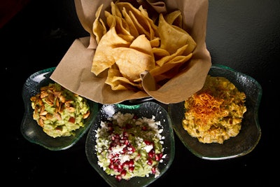 The Mercadito Group, which owns local restaurants Mercadito, Tavernita, and Little Market Brasserie, has launched its new MH Catering division, delivering fare from all three restaurants to off-site meetings and events. Menu items include a guacamole trio (pictured) and oysters, and bar options include margaritas, kegged cocktails, and house-made sodas.