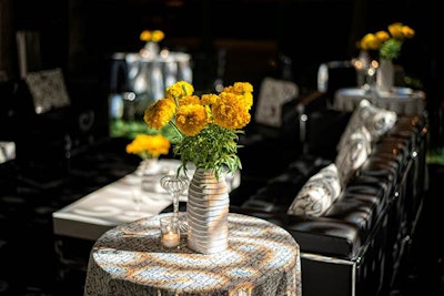 Yellow flowers provided pops of color against black-and-white tabletops.