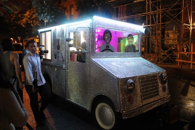 The Swarovski crystal-covered Heartschallenger ice cream truck was parked outside the entrance to the venue, offering passersby frozen treats.