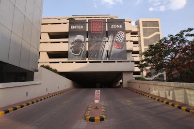 Banners on a 34,000-square-foot parking garage let guests know they were in the right place and introduced the 'Not Normal' event theme.