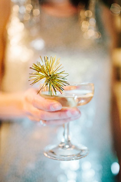 Events In the City's design details included mini handmade gold sparkly swizzle sticks in champagne saucers.