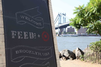 To build buzz for its latest product collaboration with charity organization Feed Projects, Target threw a rustic-Americana-theme dinner party underneath the Brooklyn Bridge in June. Freestanding chalkboard signs set up outside the open-air venue in Brooklyn Bridge Park helped guests find their way.