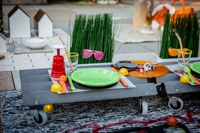 SLS Interior Design went with an urban theme that included a graffitied picnic blanket, skateboard-style mobile dining trays, and kitschy Solo cup wine glasses.