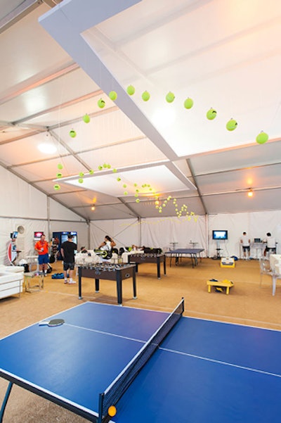 Design Cuisine suspended tennis balls at various heights to create an on-theme ceiling treatment for the lounge. When not on the court, players and their guests could take advantage of the foosball and ping-pong tables, as well as two PlayStation gaming stations.