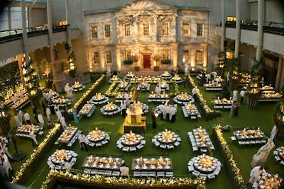 Channeling English gardens as a nod to the 'AngloMania' exhibition, the 2006 gala for the Metropolitan Museum of Art's Costume Institute placed tables in mini garden plots, dividing the museum's Englehard Court using espalier apple trees surrounded by blooming bulbs of daffodils, hyacinths, and ferns. Moreover, grass covered the floors, 30-foot-tall spirals of wisteria vine wrapped columns, and the dining tables were bare willow wood.