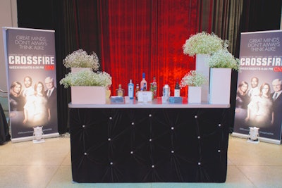 Major decor elements included Crossfire signage and the event's silver, black, and red color scheme.