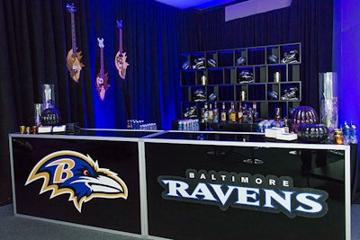 The Ravens logo decorated the front of the bar while helmets and branded footballs added detail to the back wall.