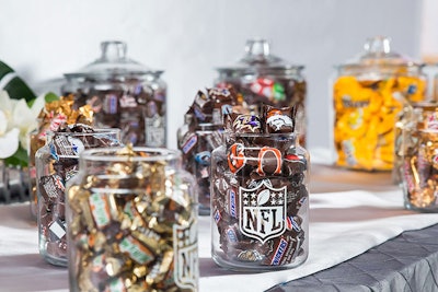 Sponsor Mars Candy provided a dessert bar with jars of fun-size Milky Way, Twix, M&Ms, and Snickers branded with N.F.L. team logos.