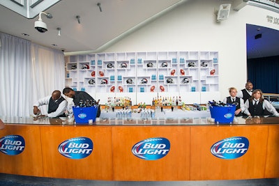 The design team branded all of the bars throughout the museum with Bud Light stickers and outfitted the alcove-style back walls with Ravens and Broncos helmets, footballs, and Bud Light beer.