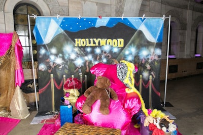 Guests could dress up in wigs, tiaras, boas, and other Smith-inspired props, as well as pose in a photo booth complete with a painted backdrop of flashing paparazzi bulbs.
