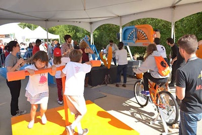 The New York University Interactive Telecommunications Program staged a competition for kids where two mechanical arms wrestled using power generated by the kids' physical activities.