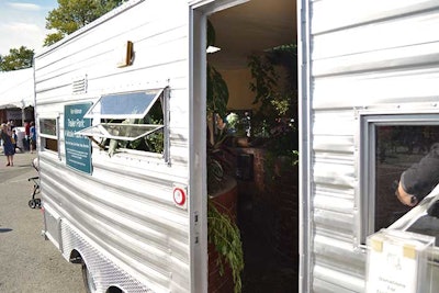 A public art project by Kim Holleman called 'Trailer Park: a Mobile Public Park' had trees and benches inside a metal trailer.