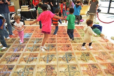 A life-size version of the puzzle game app Flow Free let people walk on a game board of tiles that lit up in reaction to their steps.
