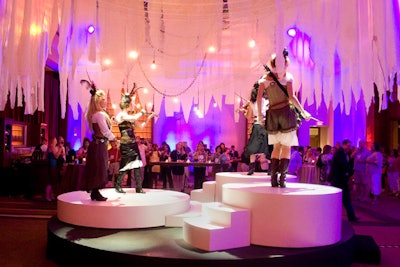 As guests entered the front area of the reception, they encountered Urban Electra, an electric string quartet outfitted in on-theme, leather-accented costumes playing atop a multilevel circular stage.