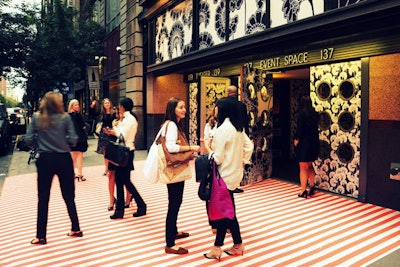 Entrance to venue decorated for fashion presentation.