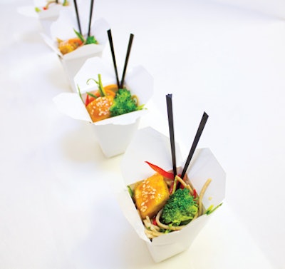 Sautéed Thai chicken over sesame noodles in micro takeout boxes, by Elegant Affairs Off-Premise Catering & Event Design in New York