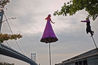 Acrobats from Australian group Strange Fruit showcased their talents outside of the tent, performing atop 15-foot poles.