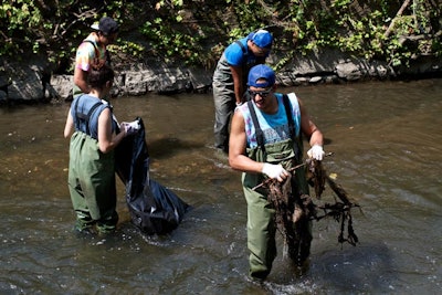 Ben & Jerry’s employees and local volunteers waded into the Sawmill River in Yonkers, New York, to help pull trash and debris from the water during the community build event on July 27.