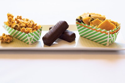 Crackle caramel corn clusters; homemade Twix bars with salted dulce de leche; and salted caramel brittle with toffee, toasted pistachios, and dark chocolate shavings, by Santa Barbara Catering in Phoenix