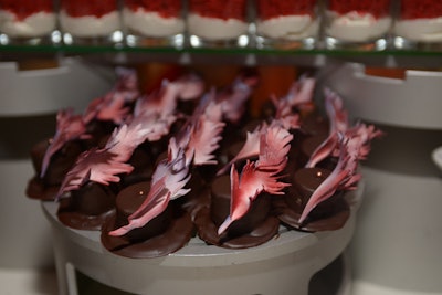 Dessert options included top-hat-shaped petit fours topped with edible chocolate feathers.
