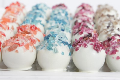 New York-based Stick & Pop has whipped up its cake pops and bonbons for brands including Swarovski, Tory Burch, Valentino, Joie, and Patrón. In addition to the company’s original menu of cake-ball flavors such as Griswald (vanilla graham cake with a marshmallow center and chocolate chips dipped in dark chocolate) or Nutty Bunny (carrot cake dipped in white chocolate with walnuts), it also specializes in custom-designed packaging, as well as custom flavors, colors, and toppings. Place orders five business days in advance for 100 or more.