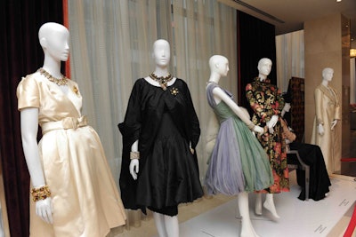 A display of vintage gala dresses from the 1950s included pieces that had been worn by the founding members of the auxiliary board.