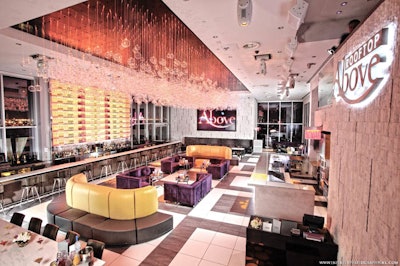 Above Rooftop: 50-foot-long Calcutta marble bar and 18-foot-tall illuminated back bar