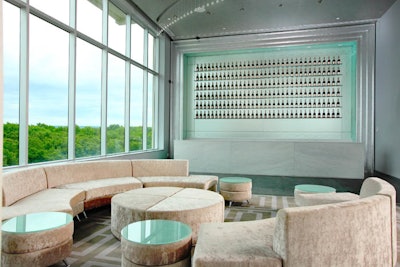 Soft seating and onyx bar with 18-foot silver leaf back bar