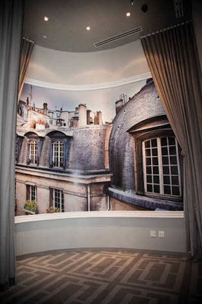 Two-story Parisian rooftop mural at ballroom entrance