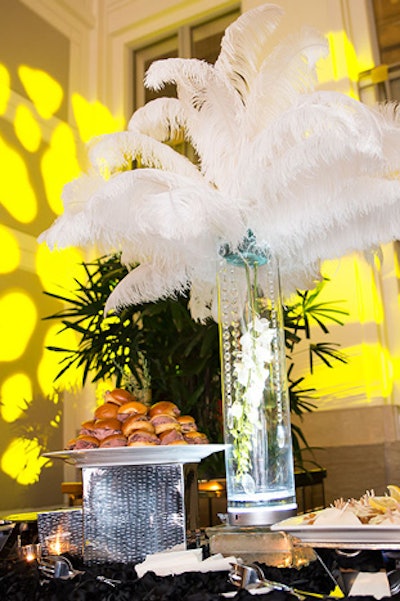 Fluffy white feathers and orchid arrangements from Petals and Hedges topped the buffet tables.