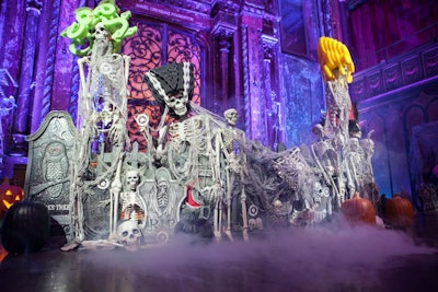 Led by its new creative director, Desi Santiago, the ExtraExtra team handled the macabre-yet-cheeky stage design, employing faux cobwebs, skeletons, headstones, and jack-o-'lanterns.
