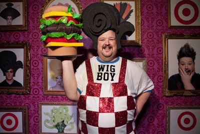 Framed portraits of Chris March, as well as those of models sporting the foam wigs, hung from the step-and-repeat wall. The costume designer and former Project Runway contestant dressed up as 'Wig Boy,' a play on the titular mascot from fast food chain Bob’s Big Boy.