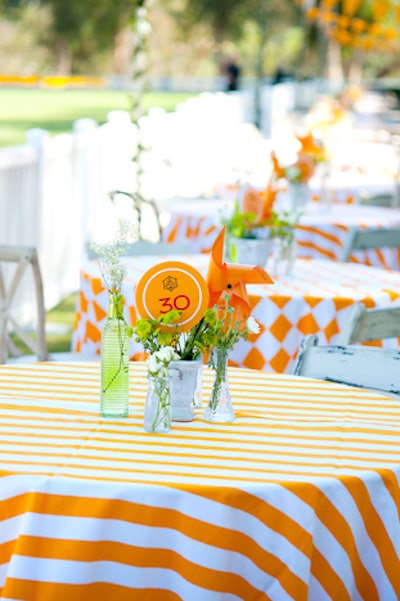 Tabletops included whimsical details like paper pinwheels.