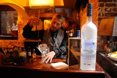 Bartenders at the basement speakeasy served custom Grey Goose vodka martinis, inviting guests to choose bitters and garnishes.