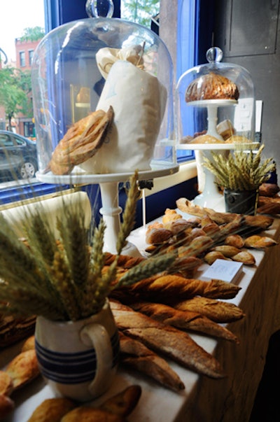 Abundant displays of breads, pastries, and shafts of wheat created a rustic decor.