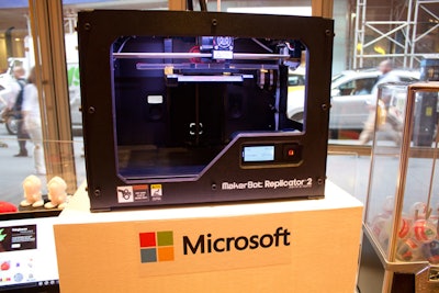 To highlight Thursday's creation theme and the software company's partnership with 3-D printer Maker Bot, which are now sold in Microsoft retail stores and powered by Windows 8, attendees could watch as a Maker Bot machine printed take-home gifts such as a comb or a bracelet.