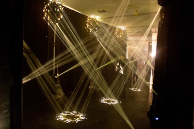 Guests entering the reception space walked through a gauntlet of beams of light created by Bentley Meeker.