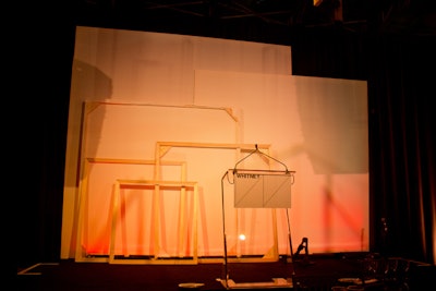 Canvas stretchers decorated the stage set up in the dining room. The decor was intended to emphasize the art-making process.