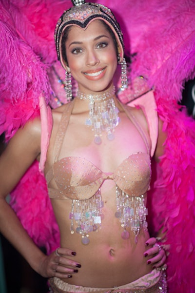 Vegas-style showgirls posed for pictures with guests.