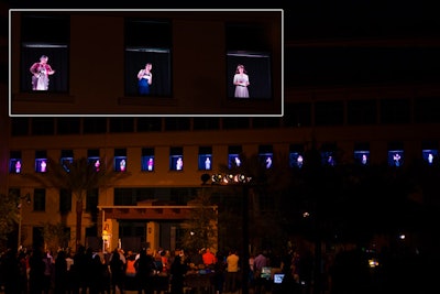 As a narrator read a story aloud to guests, windows across the building's third floor illuminated to reveal actresses portraying each of the characters.