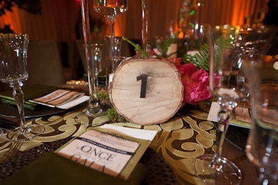 Last year, the National Association for Catering and Events hosted its annual fund-raising gala at the Liaison in Washington, where design elements drew inspiration from classic fairy tales. To add an enchanted-forest feel to the dining table centerpieces, table numbers were spray painted on wood slabs.