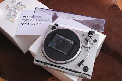 Tablets, which guests used to control the songs being played in each vignette, were embedded into household items, such as a dinner tray in the dining area and a record player in the living room.