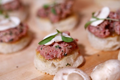 From Arlington Club chef Laurent Tourondel came filet mignon steak tartare with white mushrooms on grilled country bread rounds.