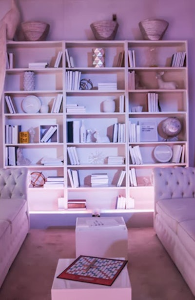 The installation's residential-looking rooms were styled with all-white furniture and accessories, to allow the projected colors to completely transform the spaces.