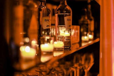 Candlelight lends an air of mystery to the back bar