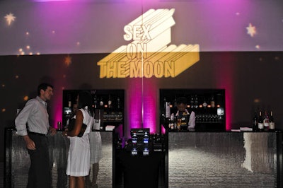 Use oversized elements, like enlarged gobos projected on the wall, to establish an event theme