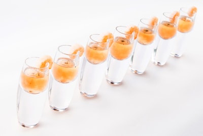 Poached shrimp served with horseradish-infused tomato water and lemon oil, by Occasions Caterers in Washington