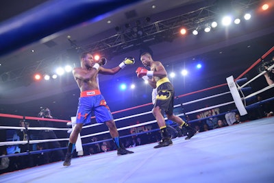 Organizers themed each of the boxing matches with recognizable dueling duos via custom-made Under Armour boxing trunks brandishing the symbols of Batman vs. Superman, Democrats vs. Republicans, and Wonder Woman vs. Catwoman.