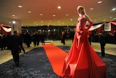 The skirt of one of the body-painted models served double-duty as a red carpeted entrance to Fight Night.