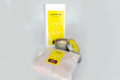 Travel-sized soy tin candle and scented bath tea